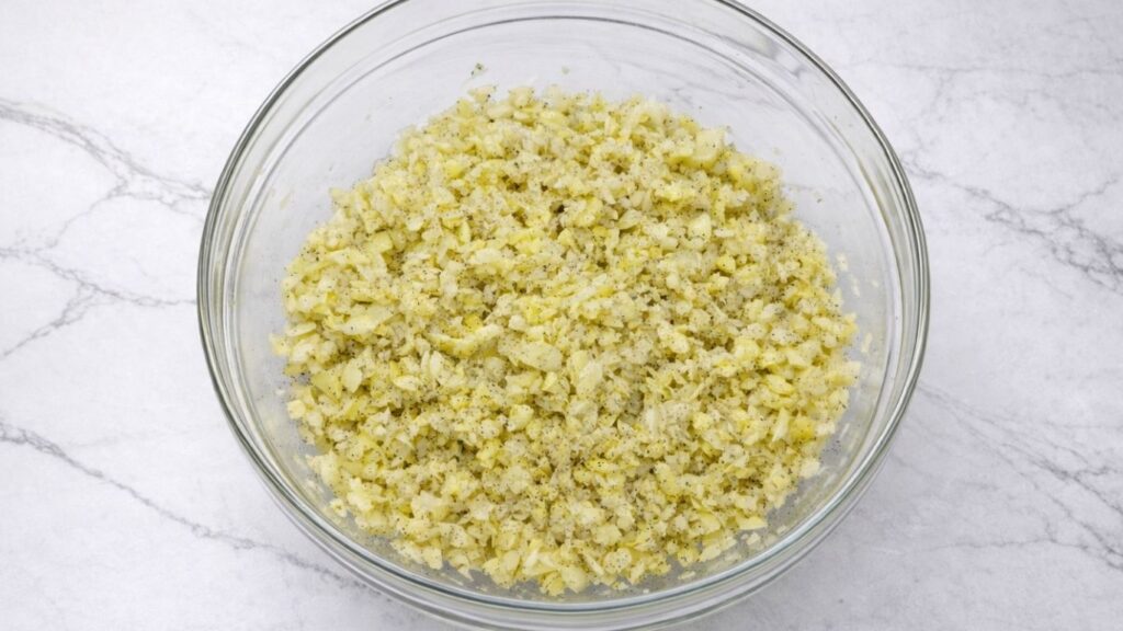 chopped potatoes and onion mixed with oil, salt, and black pepper for potato borek filling