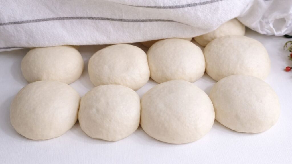 Dough balls after second rise ready for shaping mini baguettes