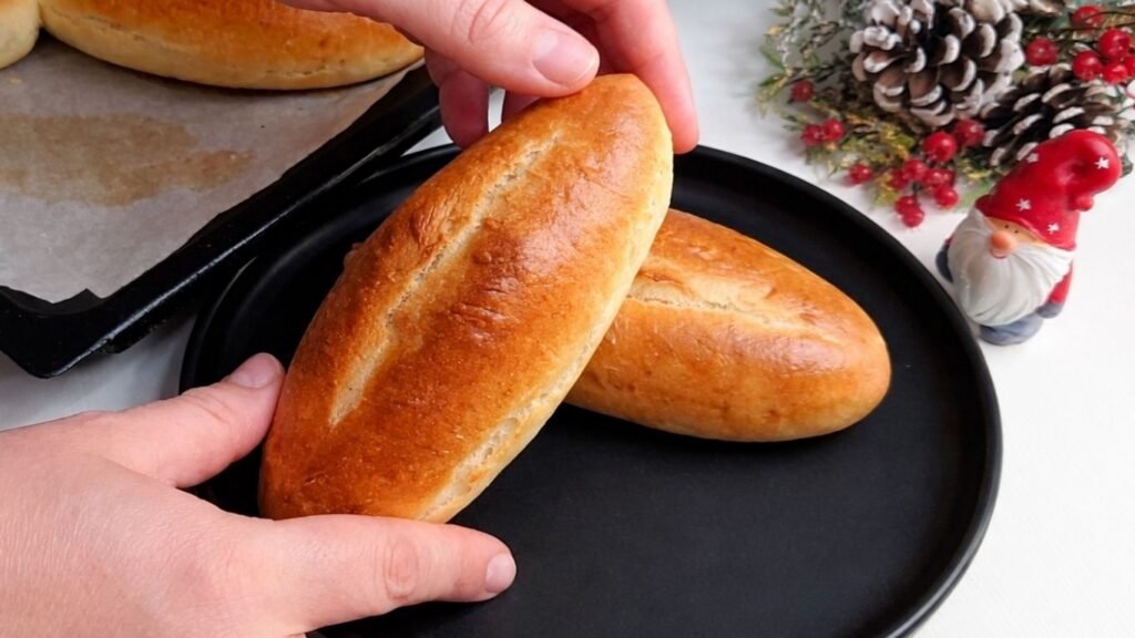 Fresh baked mini baguettes served on table