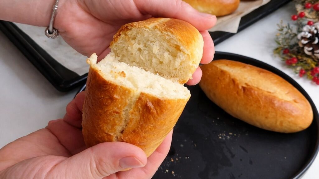 Fresh baked mini baguettes served on table