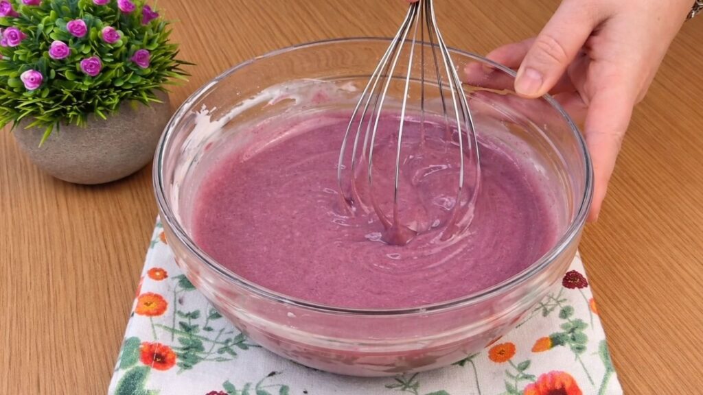 finished cream cheese frosting with blueberry jam ready for blueberry lemon rolls