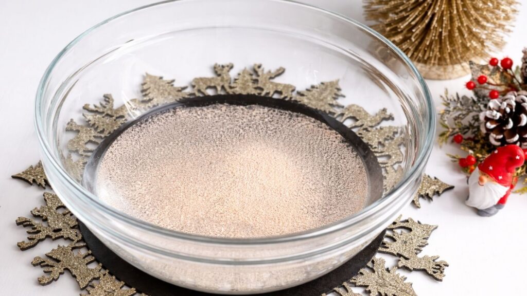 Yeast activating in lukewarm water for homemade baguettes recipe
