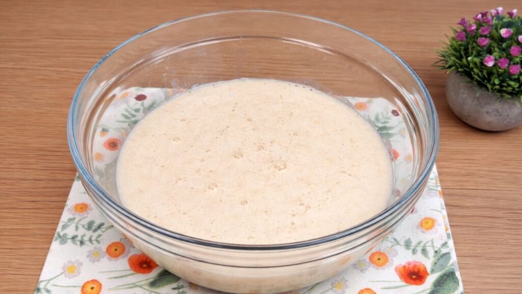 foamy yeast mixture ready for homemade cinnamon rolls dough