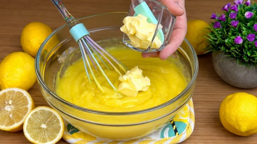 mixing butter into lemon cream