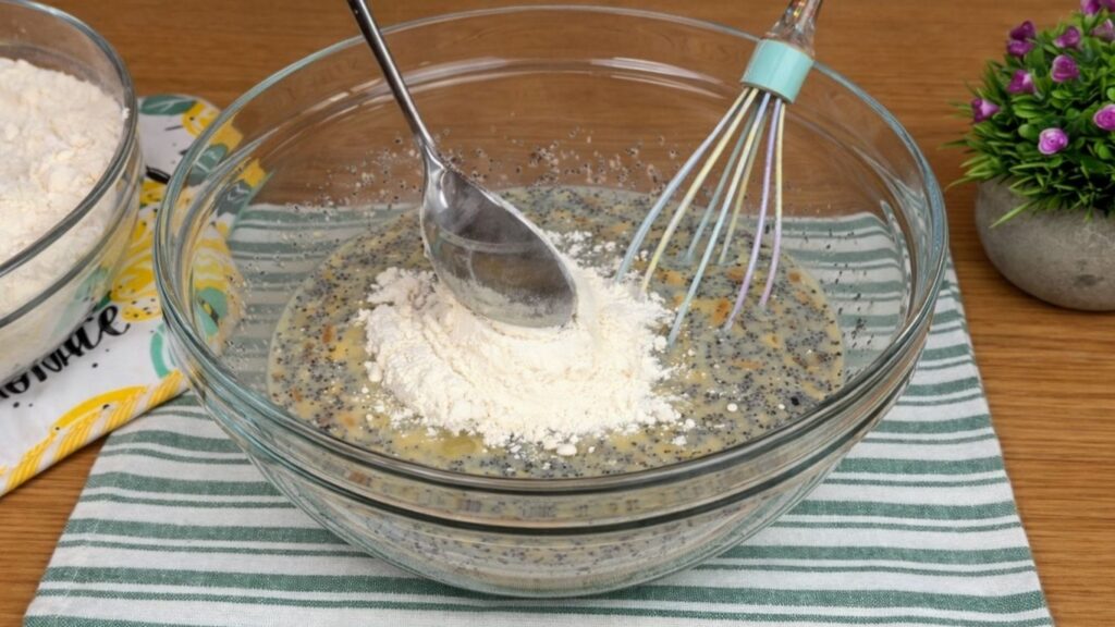 adding flour to dough mixture