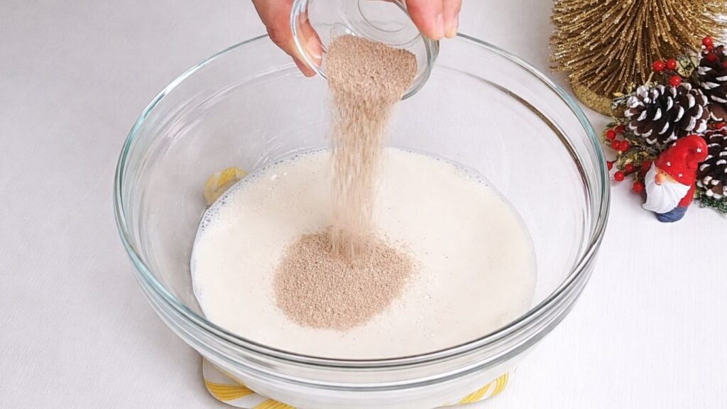 adding yeast to warm milk for milk bread dough