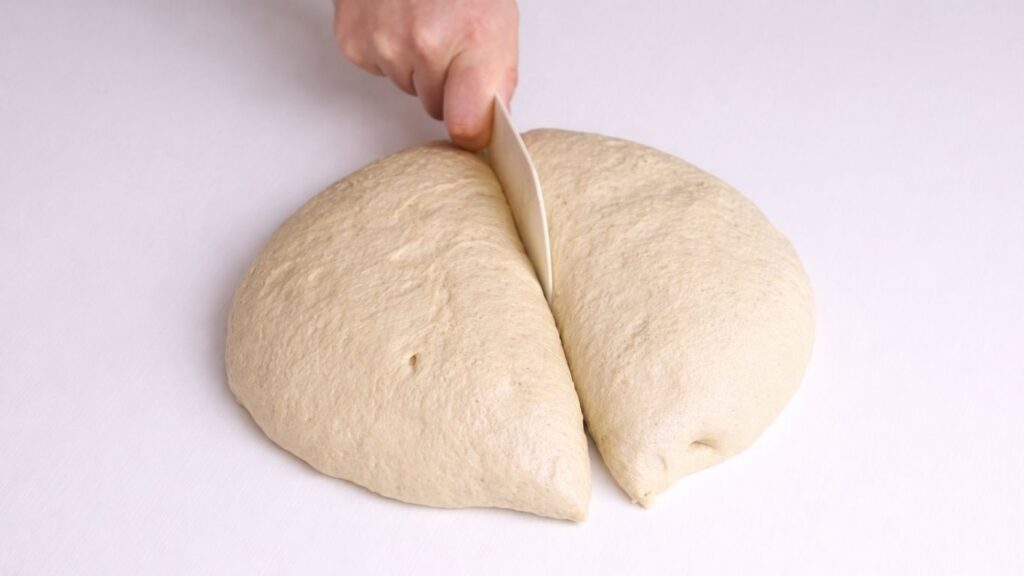 dividing milk bread dough into two equal pieces