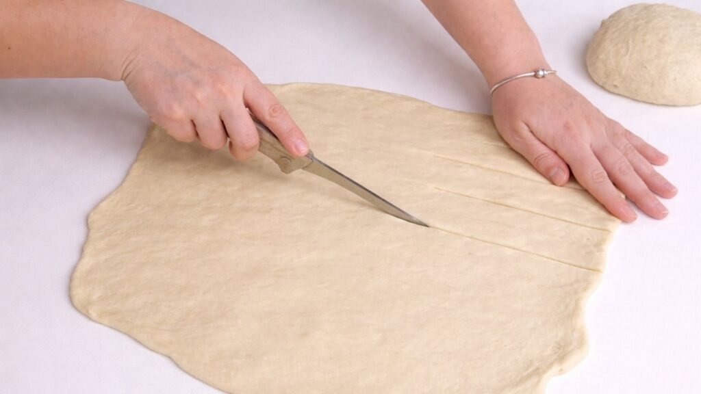 shaping dough for milk bread loaf