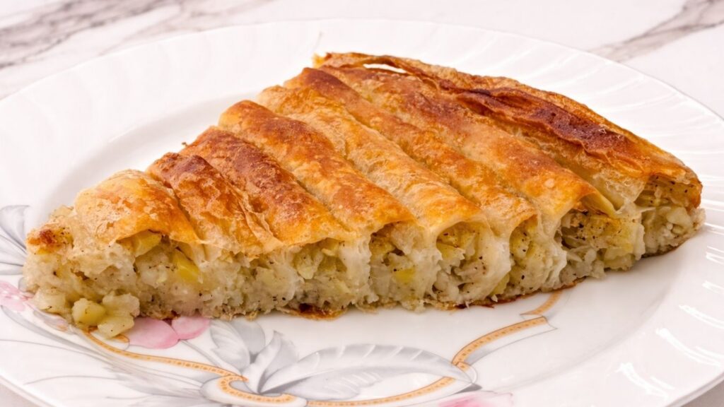 slice of baked potato borek served on a plate