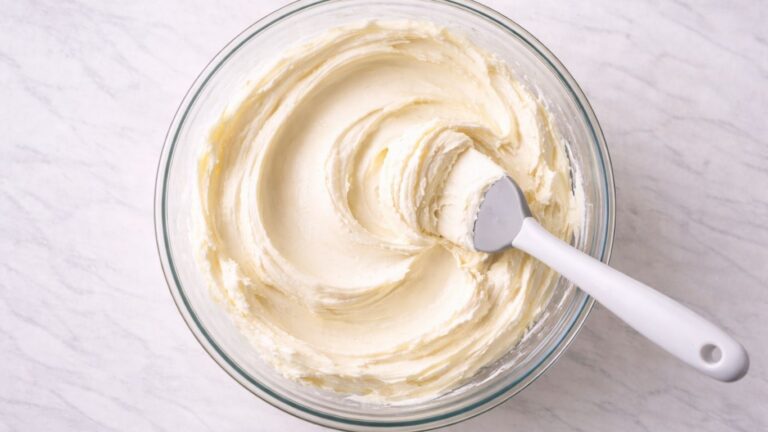 Perfect homemade buttercream recipe - smooth, creamy frosting in a glass bowl ready for cake decorating