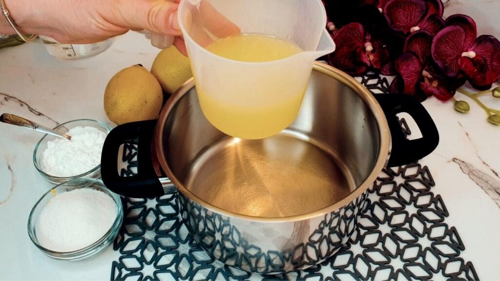 Cooking the lemon glaze for the top of the no-bake lemon cake