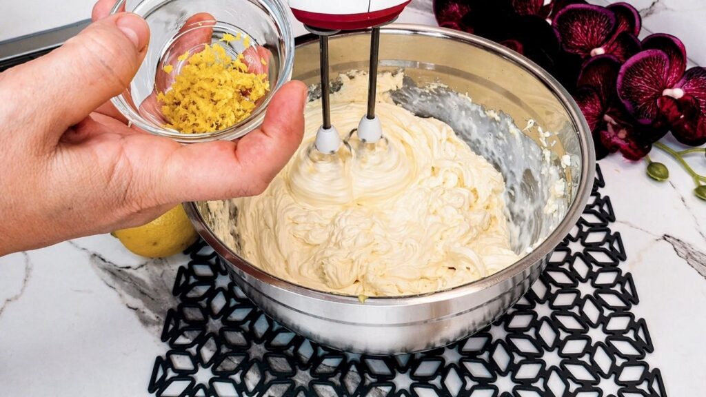 Adding lemon zest to the cream filling for no-bake lemon cake
