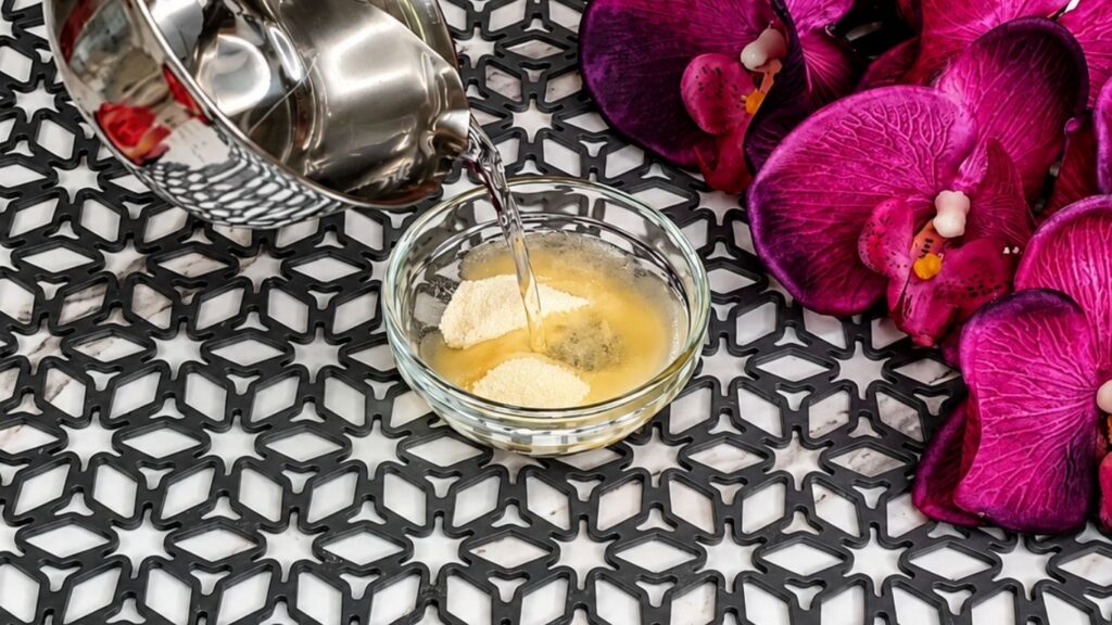 Bloomed gelatin soaking in cold water for no bake raspberry yogurt cake recipe preparation