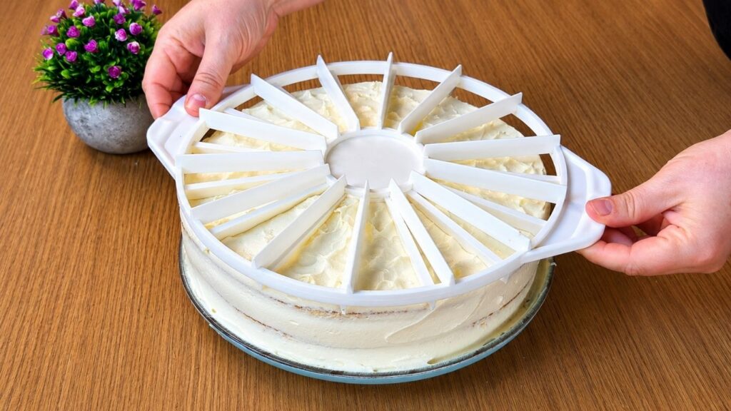 Marking cake slices on the easy strawberry cake before adding fresh strawberry decoration