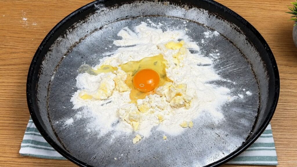 Ingredients for homemade pastry crumbs in a baking pan for baklava recipe.