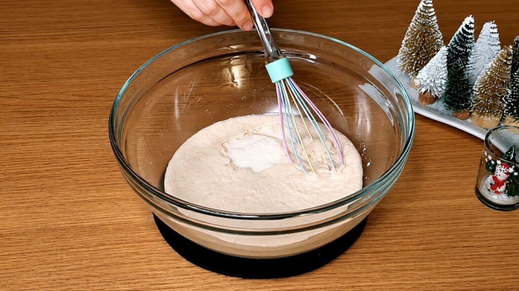 Activated yeast in lukewarm milk, foamy and ready for making chocolate star bread dough.