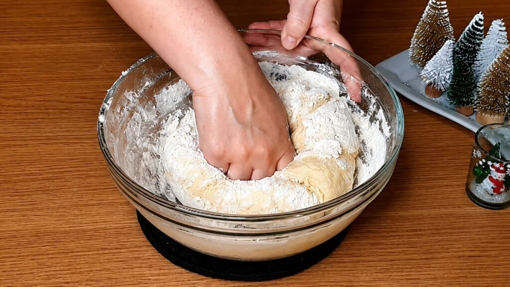 Mixing the dough by hand until it starts to come together for soft homemade chocolate star bread.