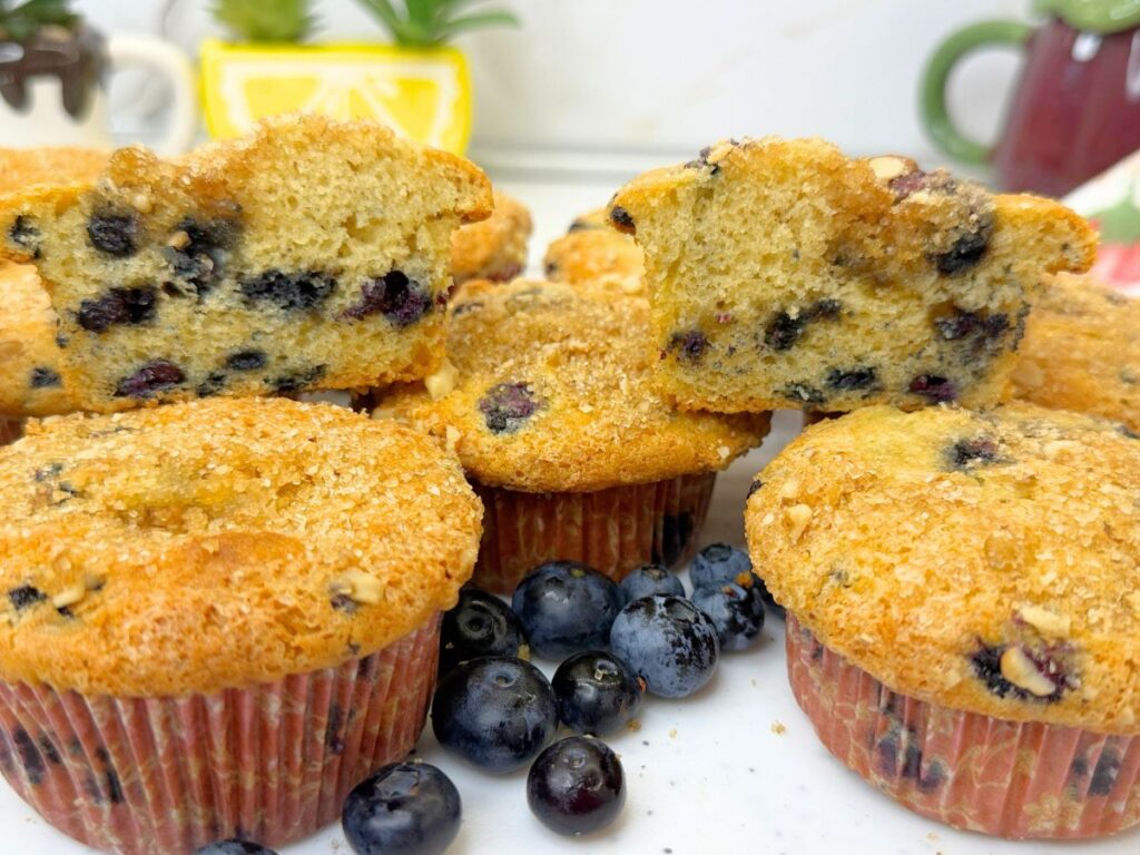 These soft and moist blueberry muffins are packed with juicy blueberries and finished with a crunchy brown sugar, walnut, and cinnamon topping. Perfect for breakfast, brunch, or a sweet afternoon treat.