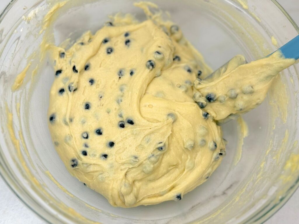 Blueberries added to the homemade muffin batter