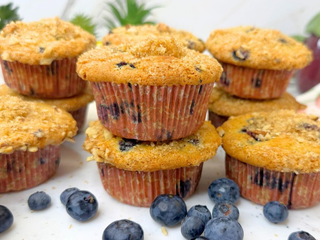 These soft and moist blueberry muffins are packed with juicy blueberries and finished with a crunchy brown sugar, walnut, and cinnamon topping. Perfect for breakfast, brunch, or a sweet afternoon treat.
