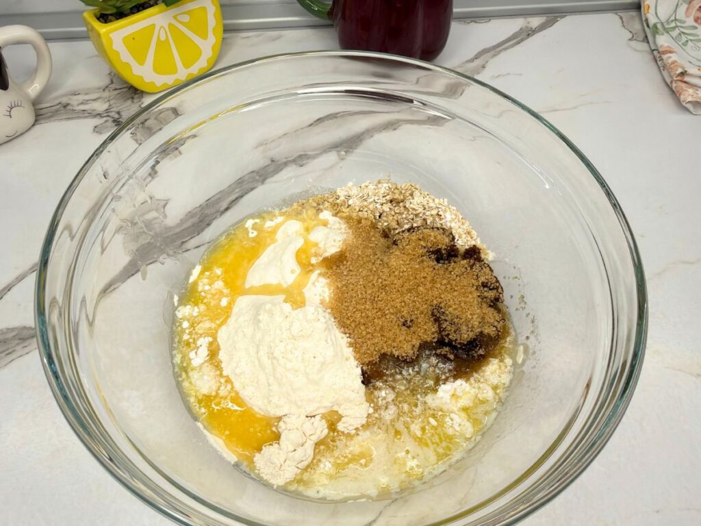 Crust and crumble ingredients combined in a mixing bowl for cherry crumb bars.