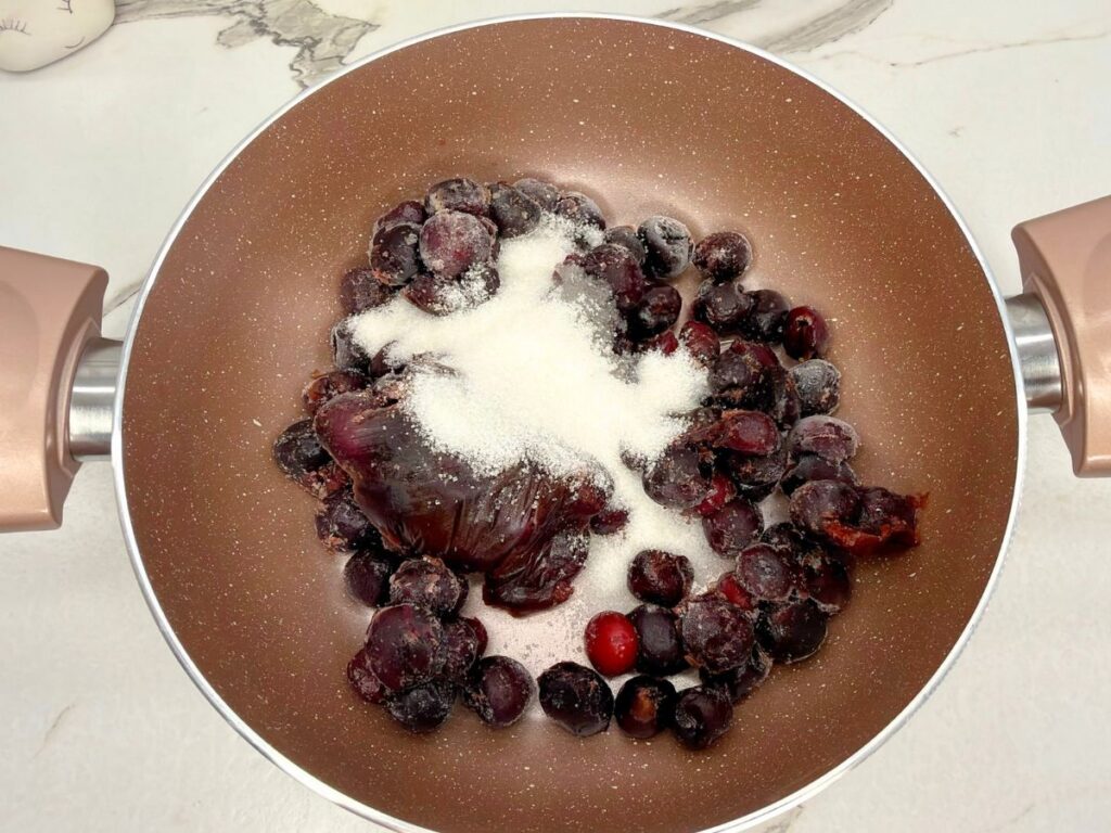 Cherry filling ingredients in a saucepan for homemade cherry crumb bars.