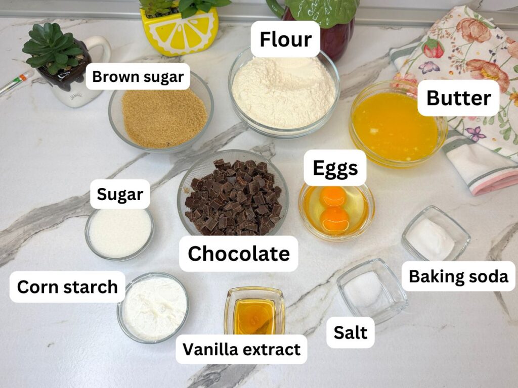 Ingredients for chocolate chip cookie bars arranged on a table.