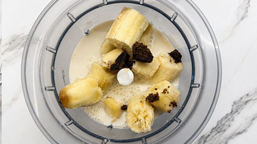 Bananas, milk, eggs, and brown sugar blended together for gluten-free banana pancake batter.