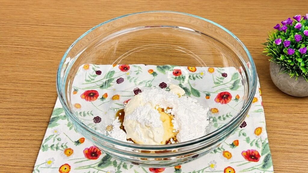 Cream cheese, powdered sugar, and vanilla in a bowl for Oreo filling.