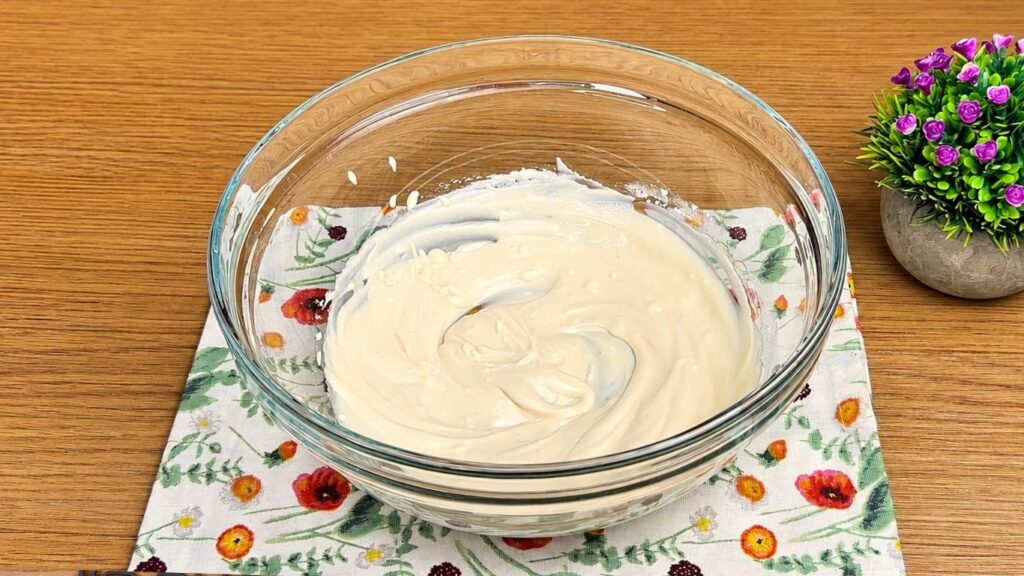 Cream cheese, powdered sugar, and vanilla in a bowl for Oreo filling.