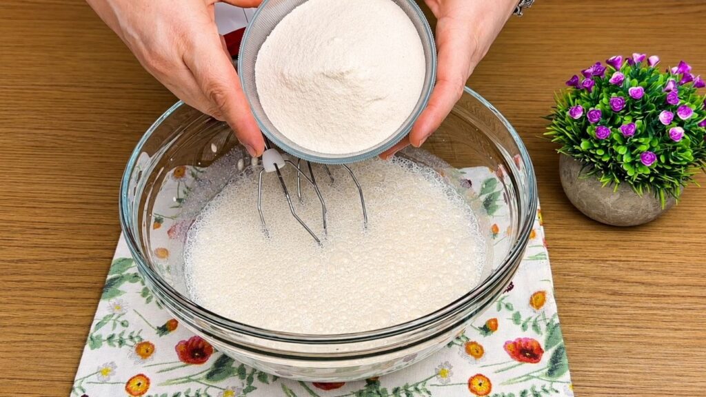 Adding vanilla cream powder to the Oreo filling mixture.