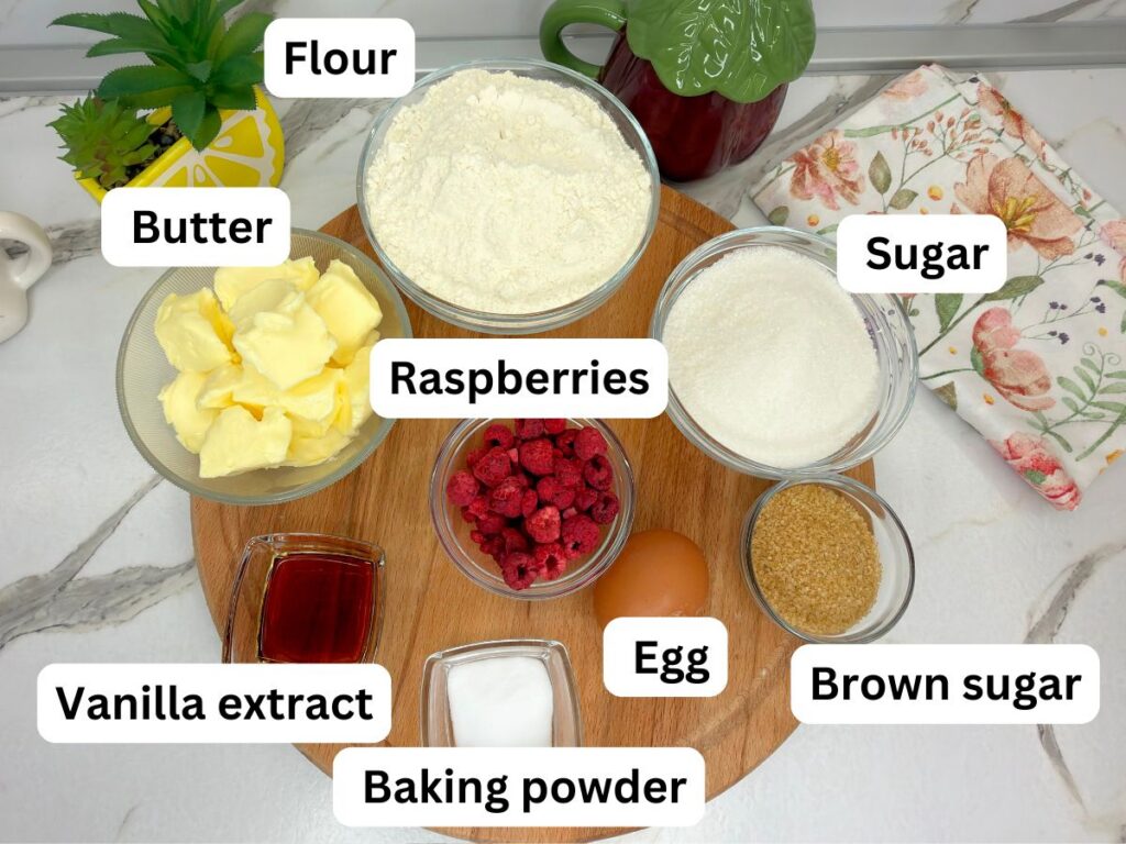 Ingredients for raspberry sugar cookies arranged on a table.