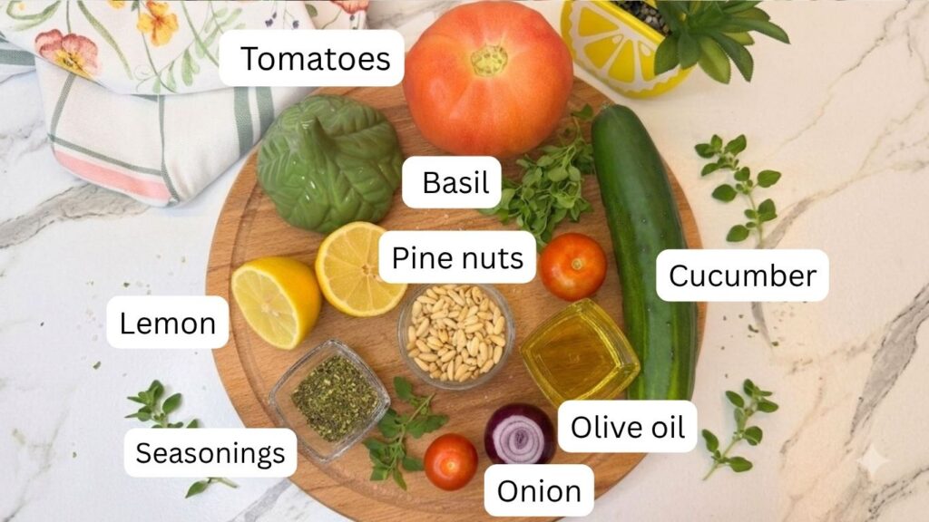 Fresh ingredients for summer cucumber salad arranged on a wooden board, including cucumber, tomatoes, red onion, basil, lemon, olive oil, seasonings, and pine nuts.