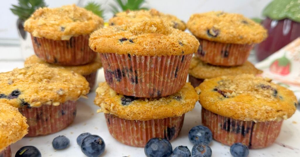 These soft and moist blueberry muffins are packed with juicy blueberries and finished with a crunchy brown sugar, walnut, and cinnamon topping. Perfect for breakfast, brunch, or a sweet afternoon treat.