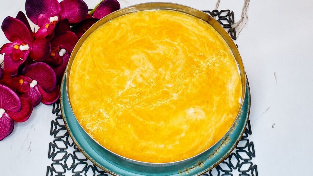 Easy no-bake peach yogurt cake covered with a smooth peach topping before chilling in the fridge.