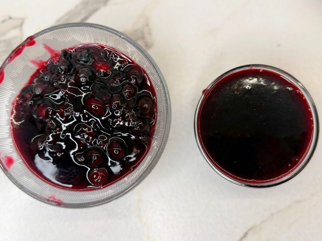 Cooked blueberry sauce strained to separate the berries from the smooth sauce