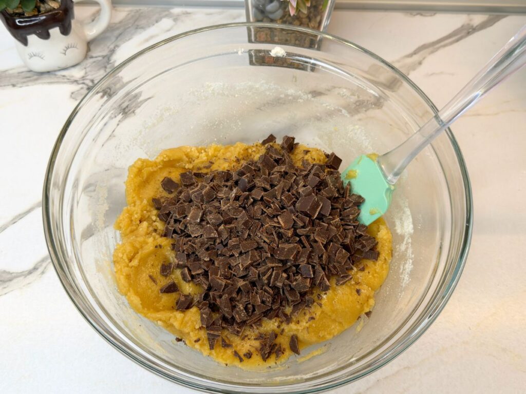 Dark chocolate chips added to the homemade cookie cake dough.