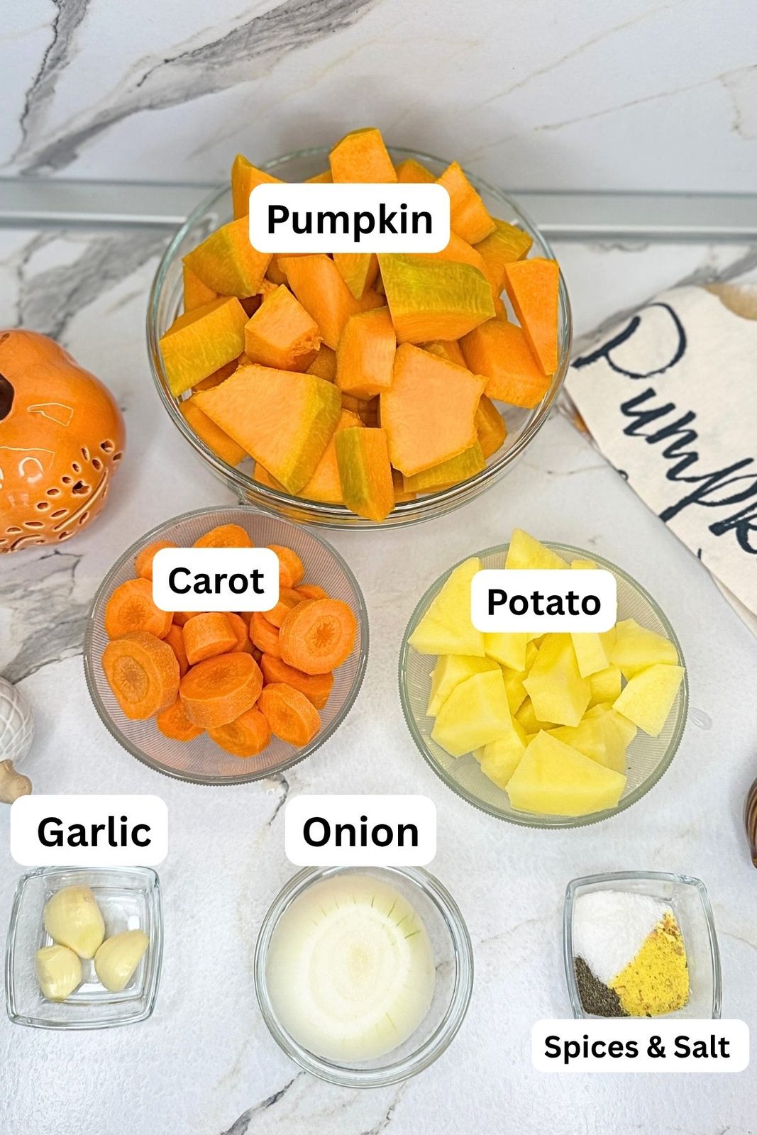 Fresh pumpkin, carrots, potato, onion, garlic, and seasonings for creamy pumpkin soup