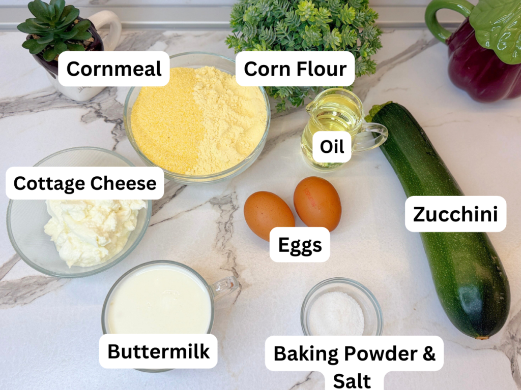 Ingredients for gluten-free zucchini muffins, including zucchini, cottage cheese, eggs, buttermilk, cornmeal, and corn flour.