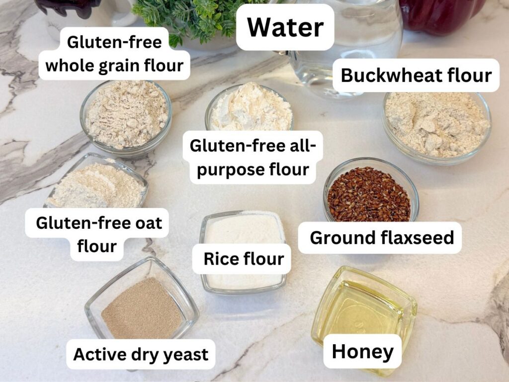Ingredients for Gluten-Free Multigrain Rolls, including gluten-free flour blends, oat, buckwheat and rice flours, flaxseed, yeast, honey, salt, and water.