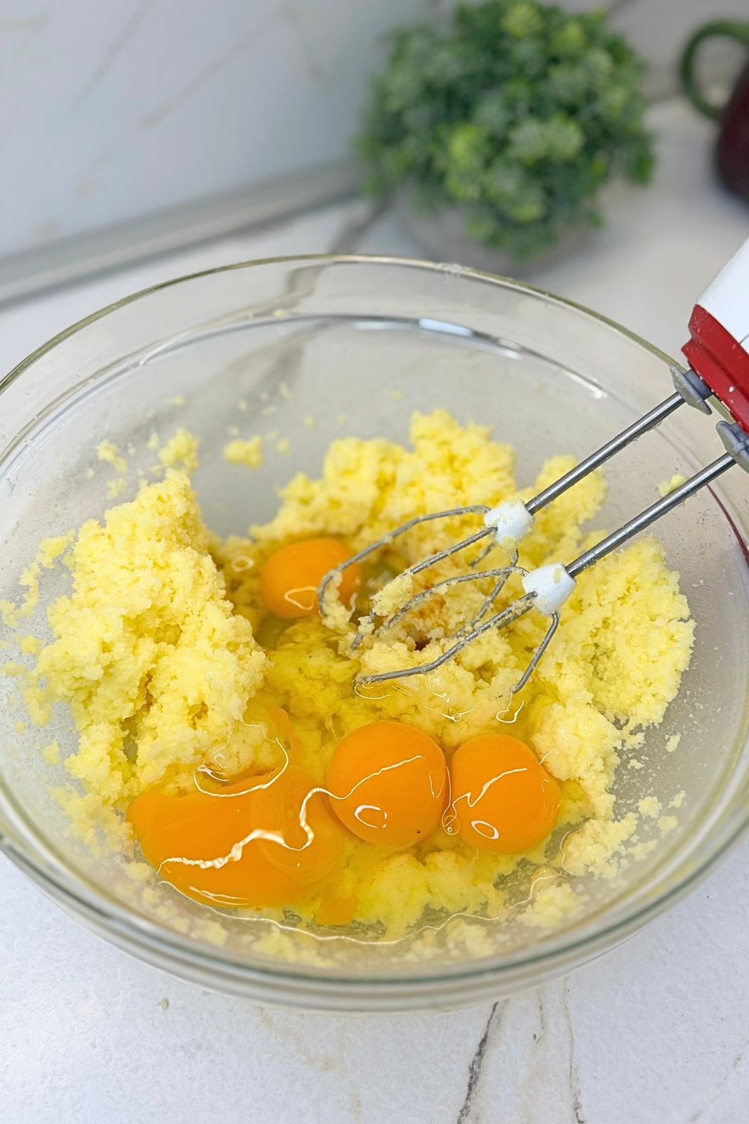 Eggs added to creamed butter and sugar for Lemon Blueberry Bundt Cake batter
