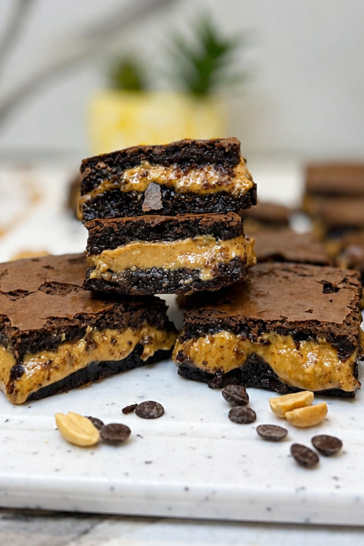Peanut butter brownies with fudgy chocolate layers and a thick creamy peanut butter center.