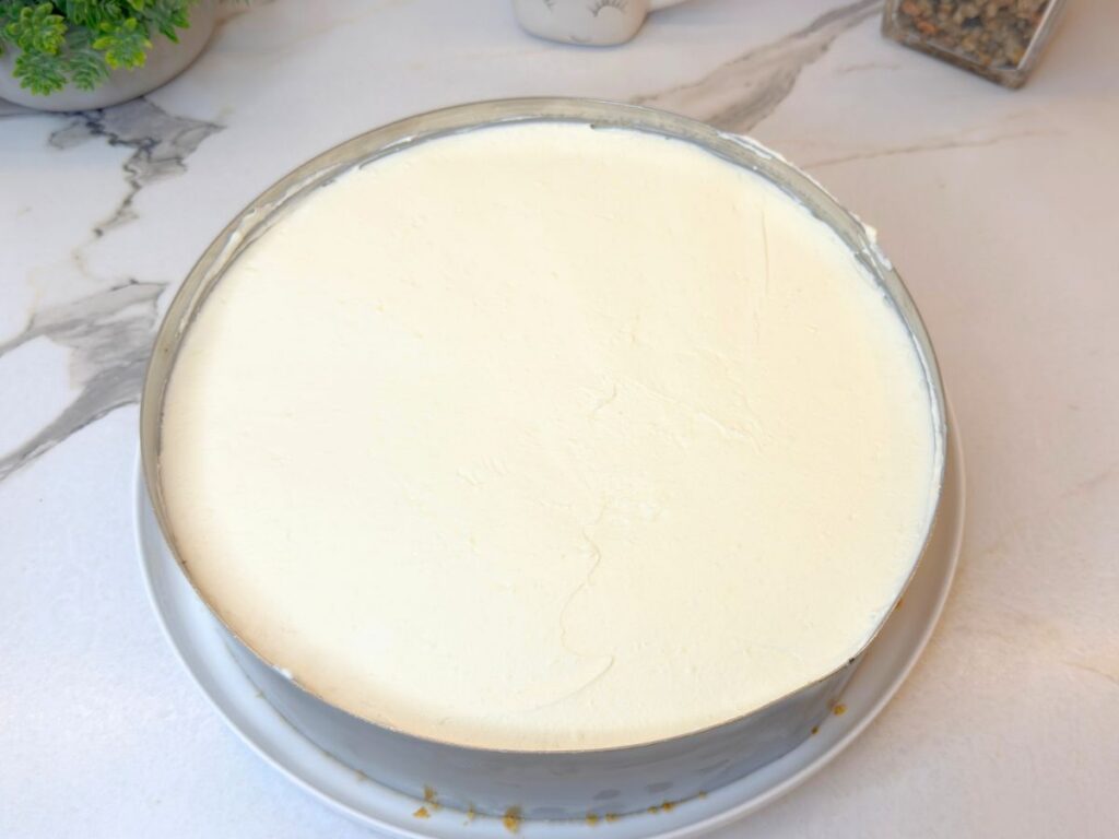 Second cream cheese layer smoothed evenly over the raspberry filling