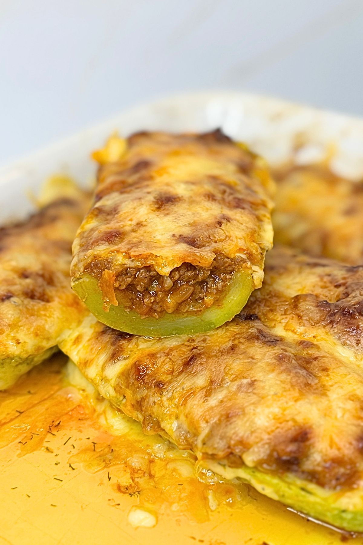 Stuffed zucchini boats with ground beef and golden melted cheese.