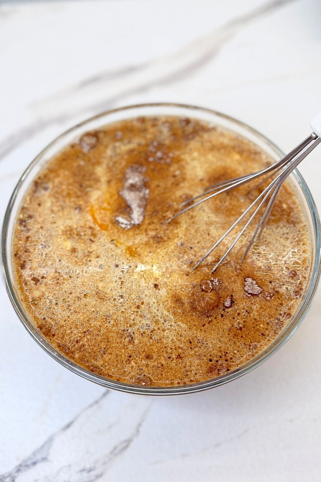 Oil, eggs, vanilla, buttermilk, and hot coffee mixed for the coffee chocolate cake batter