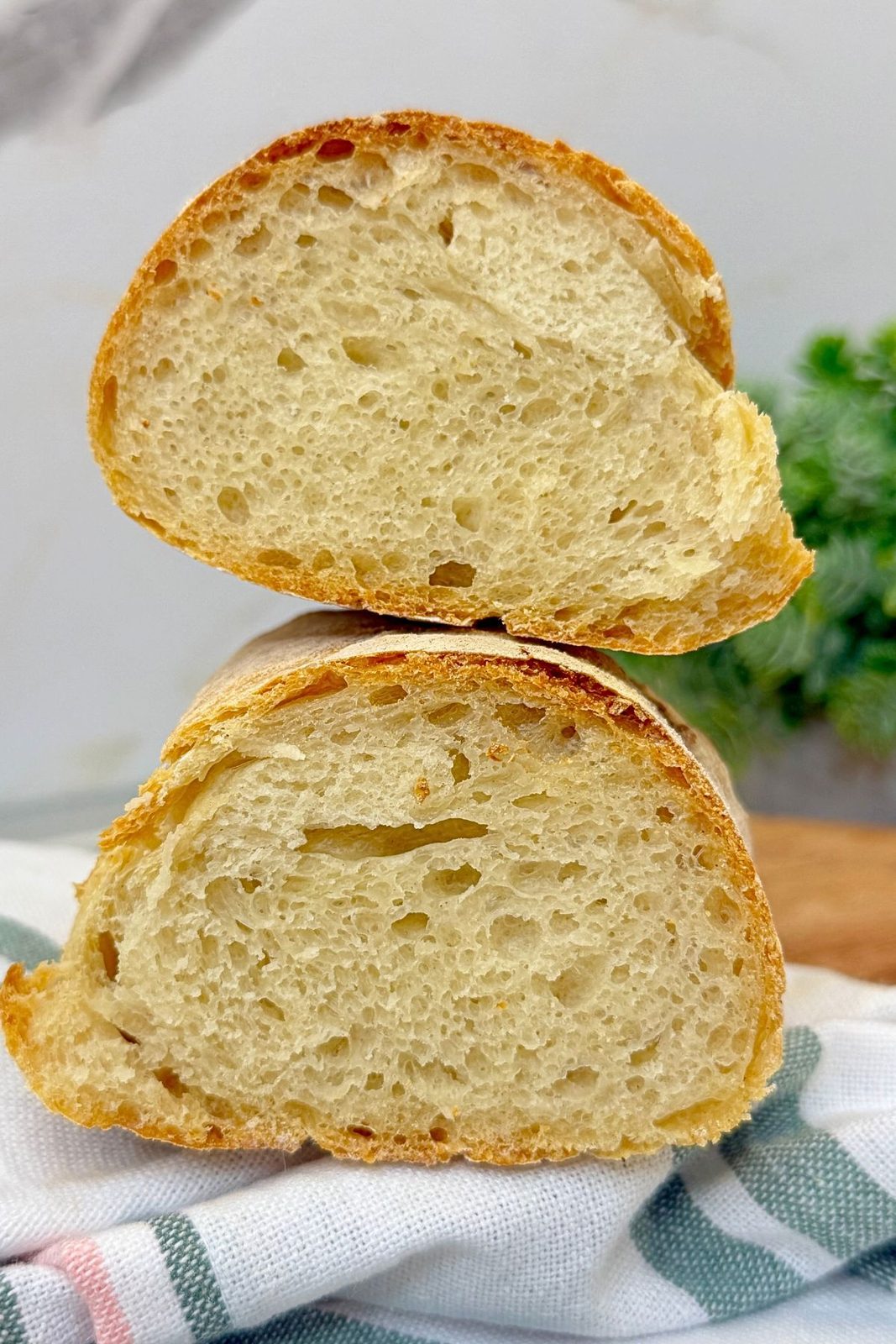 Close-up of rustic homemade bread with a crispy golden crust and soft airy crumb