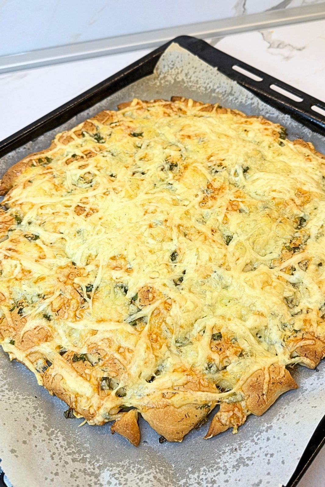 Freshly baked homemade garlic bread with melted golden cheese
