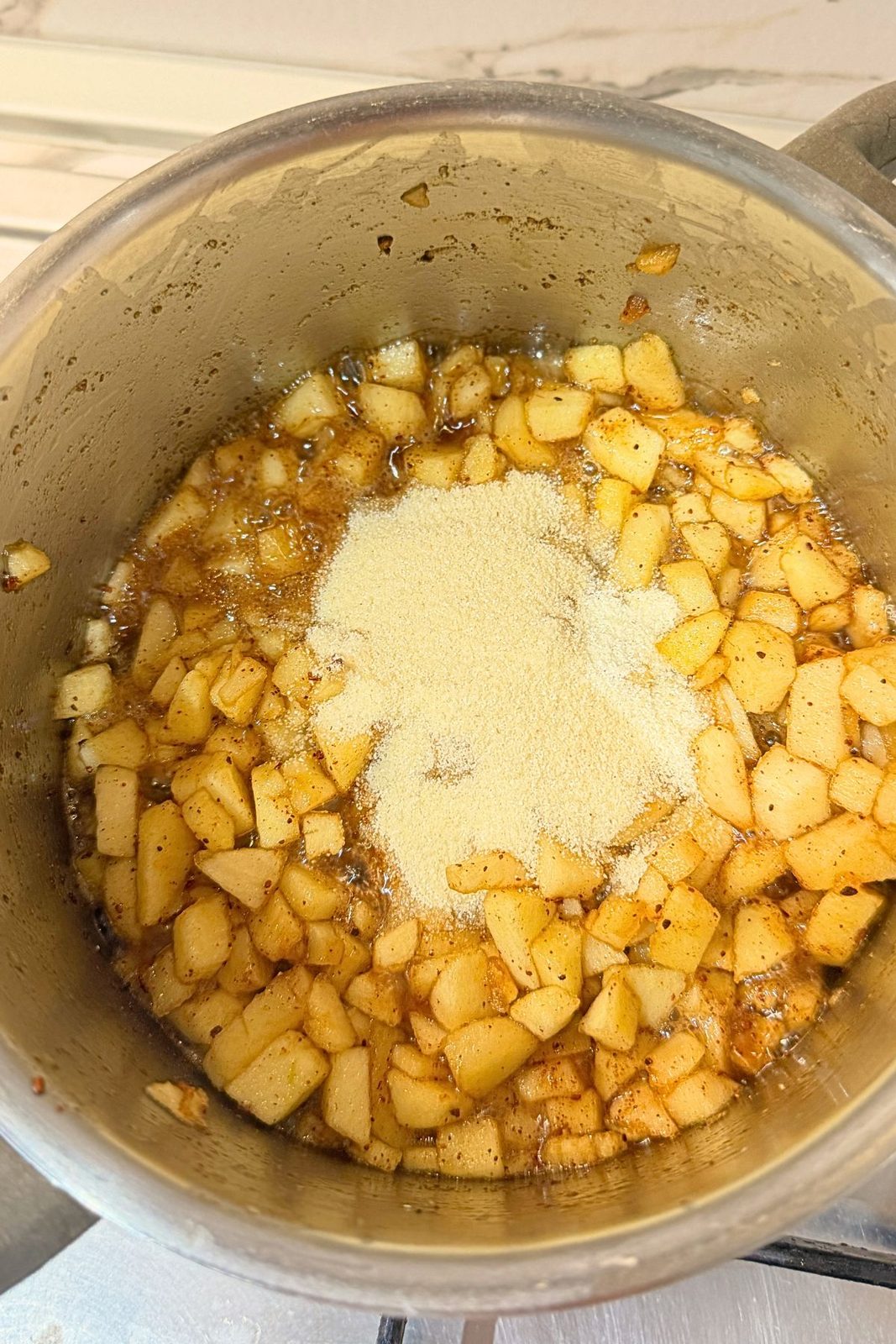 Semolina added to cooked cinnamon apples to thicken the apple turnover filling.