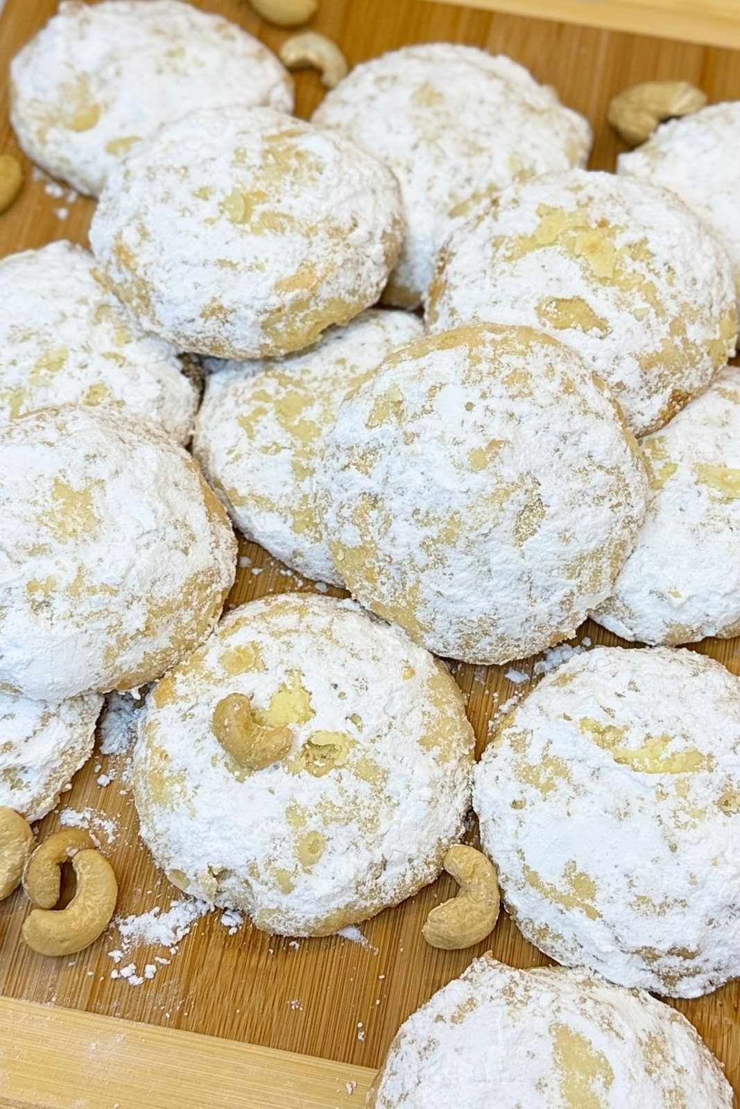 Buttery cashew meltaway cookies coated with powdered sugar
