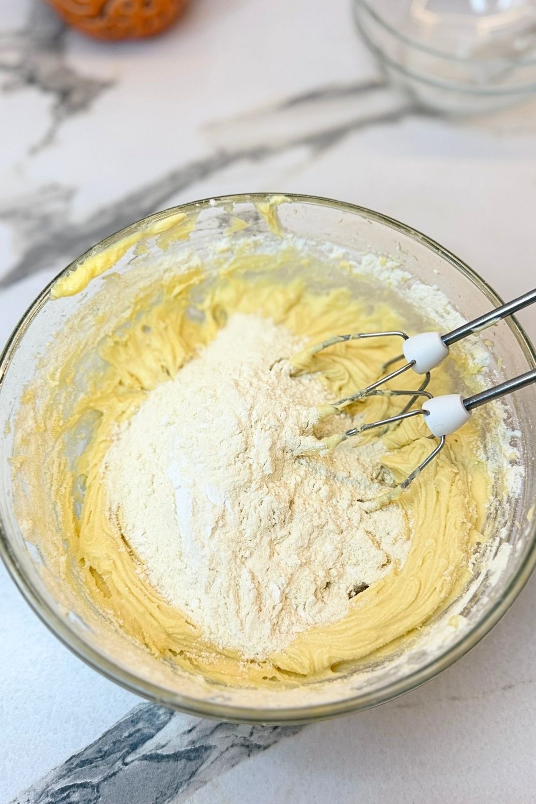 All-purpose flour added to the creamed butter mixture for cashew cookies